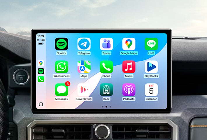 In-car view showing the wireless Apple CarPlay interface on a Toyota Sienna head unit touchscreen, displaying apps like Phone, Messages, Maps, and Spotify for easy access while driving.