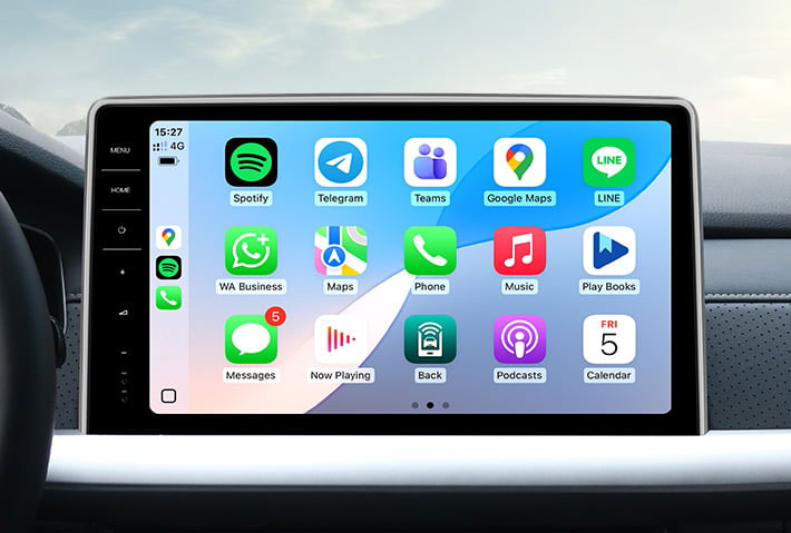 In-car view showing the wireless Apple CarPlay interface on a Toyota Sienna head unit touchscreen, displaying apps like Phone, Messages, Maps, and Spotify for easy access while driving.