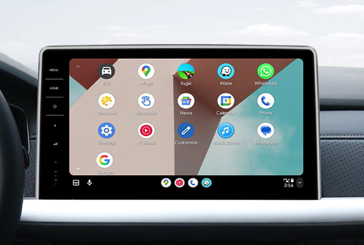In-car view showing the Android Auto interface on a Toyota Sienna head unit, featuring a multi-pane layout with navigation and communication apps, compatible with both wired and wireless connections.