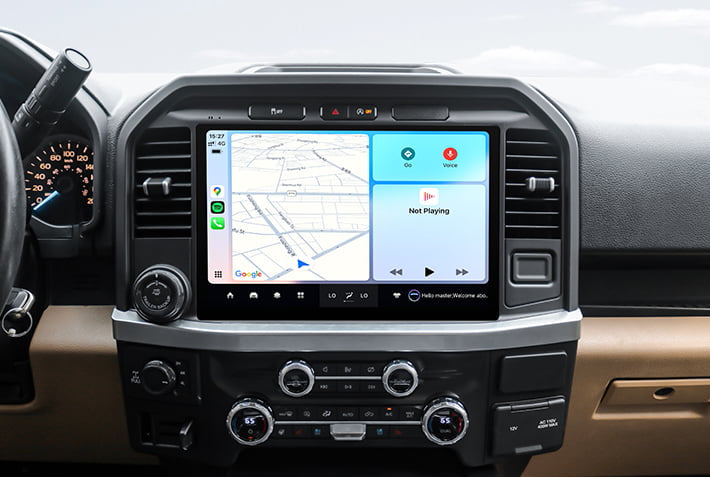 In-car view showing the Android Auto interface on a Toyota Sienna head unit, featuring a multi-pane layout with navigation and communication apps, compatible with both wired and wireless connections.