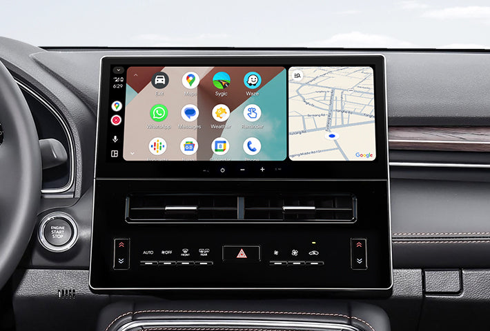 In-car view showing the Android Auto interface on a Toyota Sienna head unit, featuring a multi-pane layout with navigation and communication apps, compatible with both wired and wireless connections.