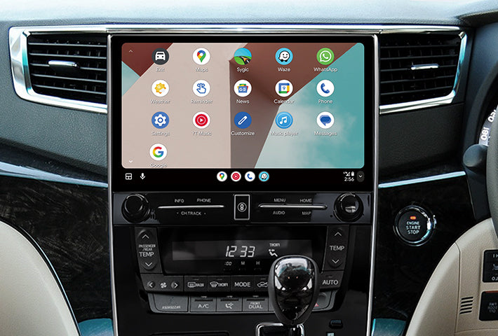 In-car view showing the Android Auto interface on a Toyota Sienna head unit, featuring a multi-pane layout with navigation and communication apps, compatible with both wired and wireless connections.